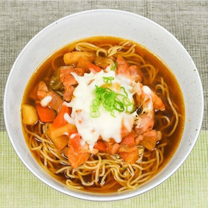 Signature Shoyu Ramen with Cheese Dak Galbi, (shredded mozzarella cheese) topping with green onions