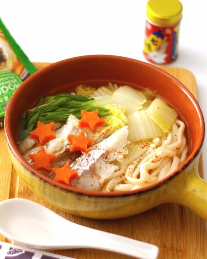 Hot pot style udon topping with cod, nappa cabbage, carrot, shichimi pepper