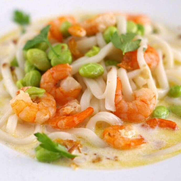 Creamy shrimp udon made with Shrimp Flavor Udon topping with edamame, parsley, and fried onion