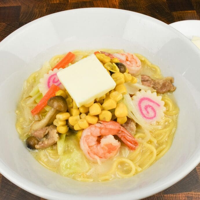 Nagasaki Champon (a regional dish of Nagasaki, Japan) topping with butter and corn with seafood and vegetables