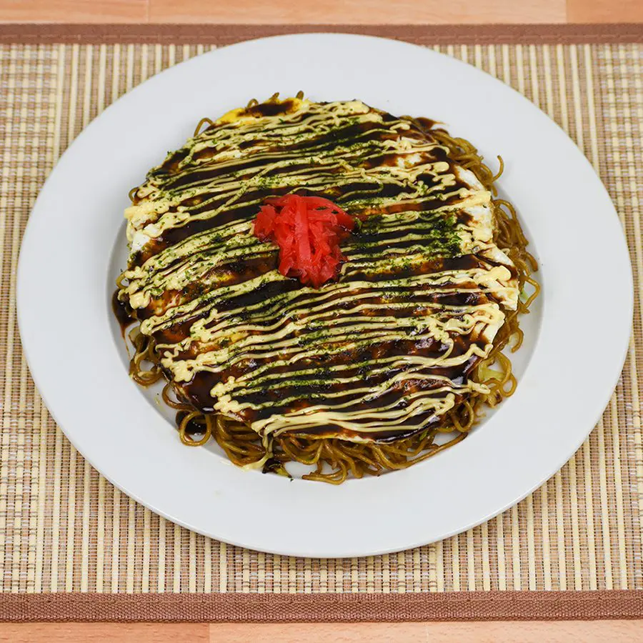 Hiyoshima-yaki, a regional-style okonomiyaki layered with fried eggs and yakisoba noodles