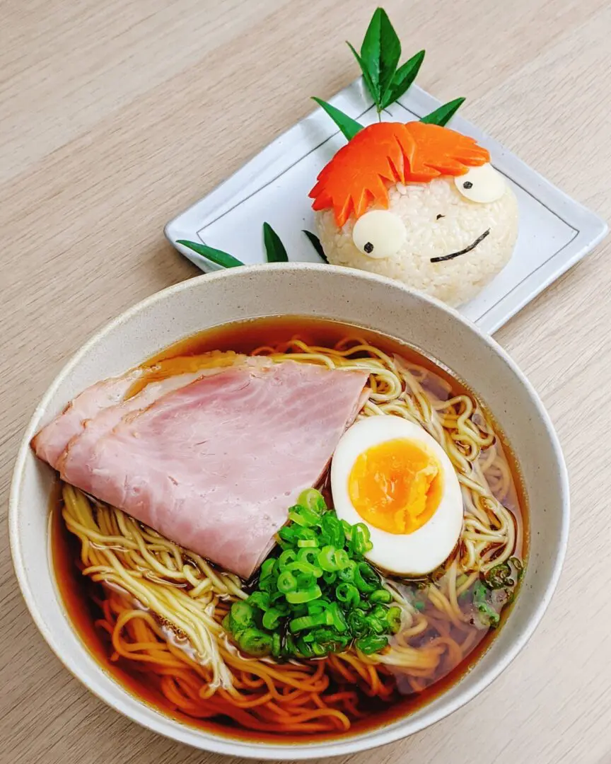 Myojo-style ponyo ramen which is a Japanese film by Studio Ghibli, topping with ham, ajitsuke tamago (marinated egg), and green onion