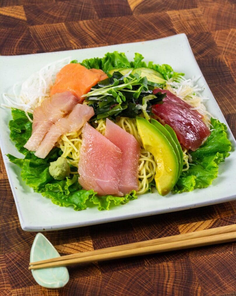 Hiyashi chuka (cold ramen) topping with fresh sashimi, cucumber, avocado, rehydrated seaweed with the citrus flavor (yuzu) sauce