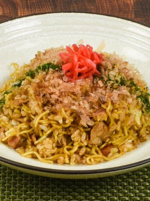 Soba meshi, originated from Kobe, Japan - a mixed dish of yakisoba and fried rice topping with bonito flakes, red ginger, and aonori