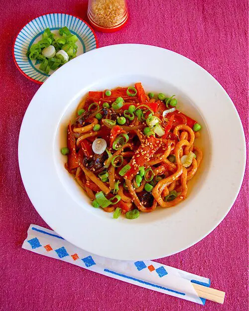 Sweet and Savory Udon using Jumbo Udon Noodles Only topping with carrots, mushroom, and sprinkle in green peas