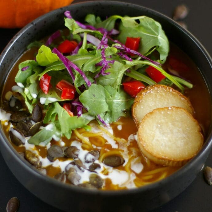 Premium Vegetarian Shoyu Ramen made with pumpkin pastes and king oyster mushrooms topping with colorful vegetables and coconut milk