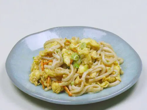 Yaki Udon (A stir-fried udon) mixed with eggs, carrots, and green onion