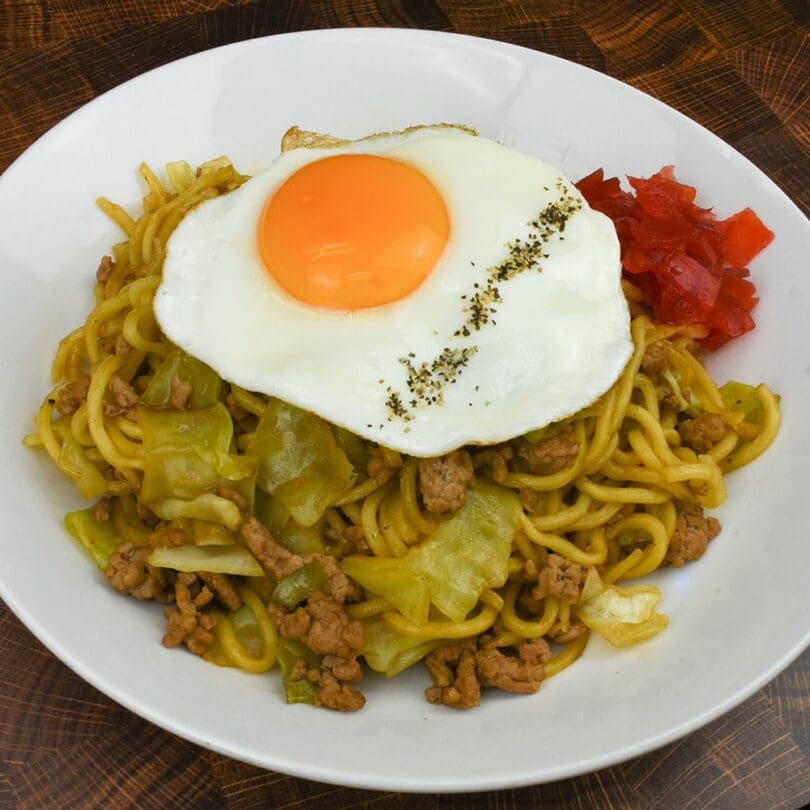 Yokote Yakisoba, a regional fast food originating from Akita, topping with a sunny side up egg and Fukujinzuke (a red pickled vegetable)