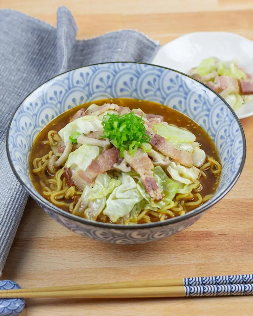 Signature Miso Ramen topping with bacons, cabbage, mushrooms, and green onion