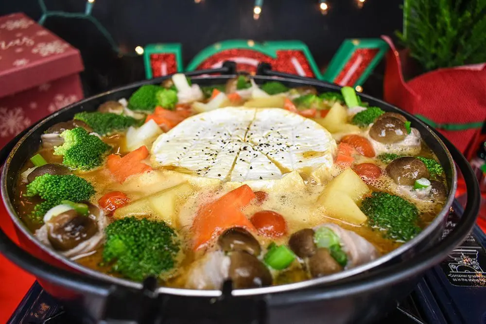 Camembert cheese fondue hotpot with Signature Miso Ramen, pork belly wrapped mushrooms and vegetables