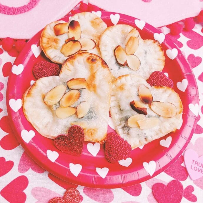 Heart shaped baked chocolate wonton for Valentine’s day topped with almonds