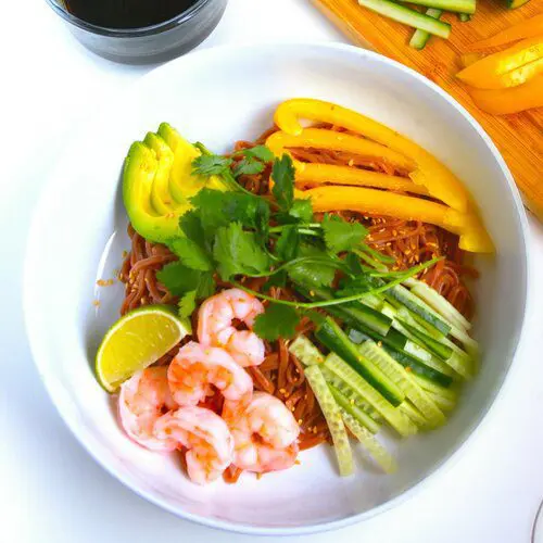 Shrimp and avocado hiyashi chuka (cold noodles) with Beet Noodles topping with cucumber, ham, and shredded eggs