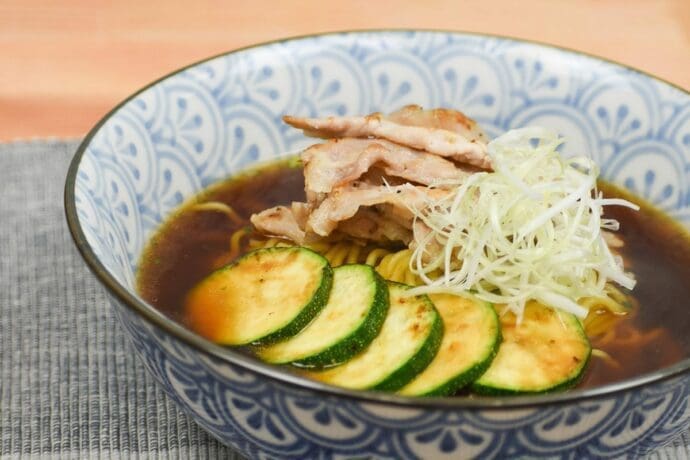 Signature Shoyu Ramen with shiokoji pork, zucchini, and scallion