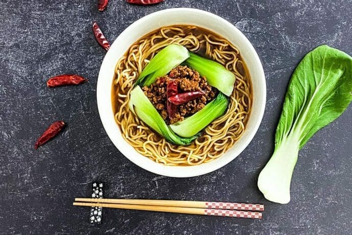 Signature Spicy Miso Ramen with a spicy and savory ground pork (soboro) and bok choy