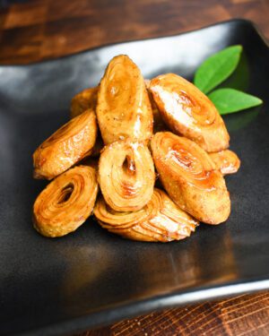 Sweet fried wonton, rolled up wonton wrappers and cut at an angle, which looks like a wood stump