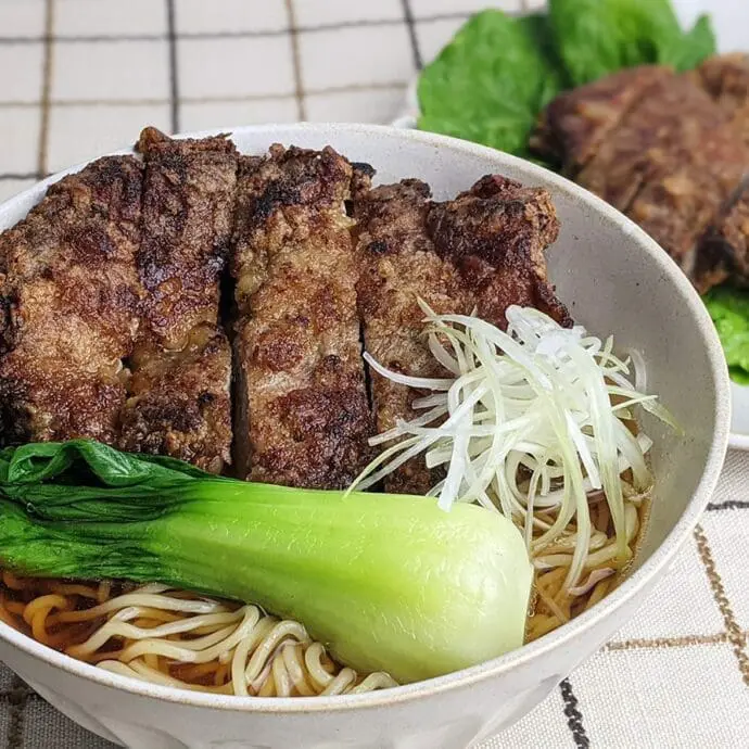 Shoyu ramen with pork spare ribs topping with bok choy