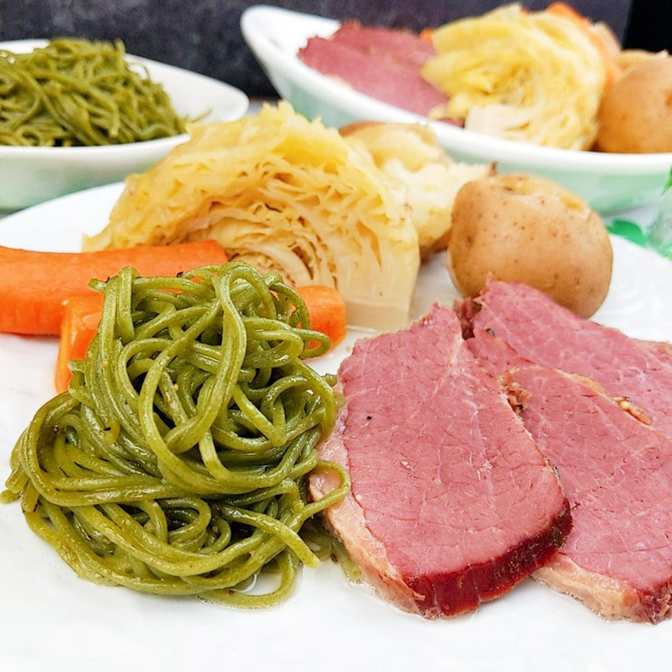 Corned beef and cabbage with Kale Noodles recipe includes carrots, cabbage, potatoes, corned beef pressure cooked. Side with Kale Noodles to add some green to St. Patrick's Day.