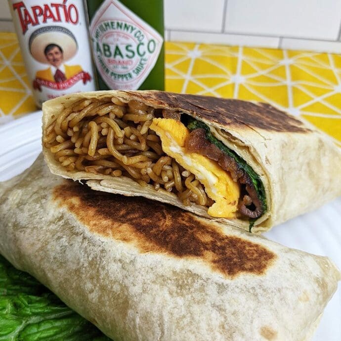 Yakisoba Burrito, yakisoba, pork, egg, and leaf lettuce are wrapped by tortilla