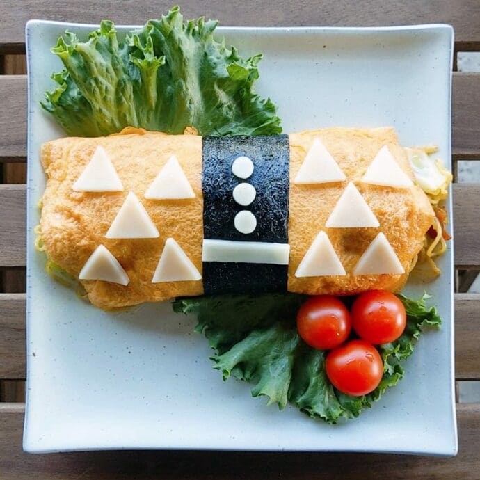 Zenitsu, Demon Slayer, Omu Curry Soba (Yakisoba wrapped inside an omelet) topping with cheese and nori seaweed, inspired by Kimetsu no Yaiba a.k.a. Demon Slayer and the character Zenitsu