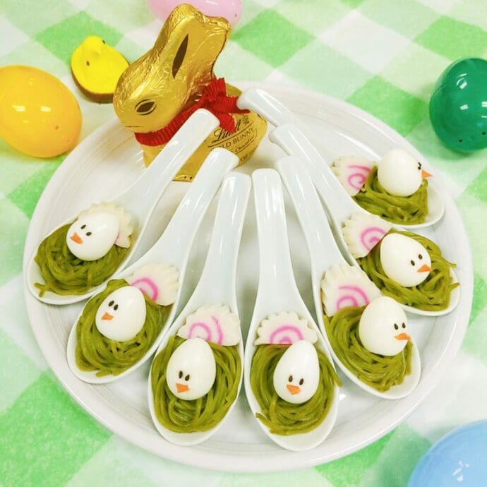 Easter appetizer with Kale Noodles top with the decorated quail egg (the chicks) on renge spoons