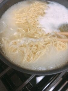 Deviled egg on shoyu ramen nest Step 3 - noodles in boiled water