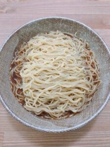 Deviled egg on shoyu ramen nest Step 5 - noodle soak in the flavor