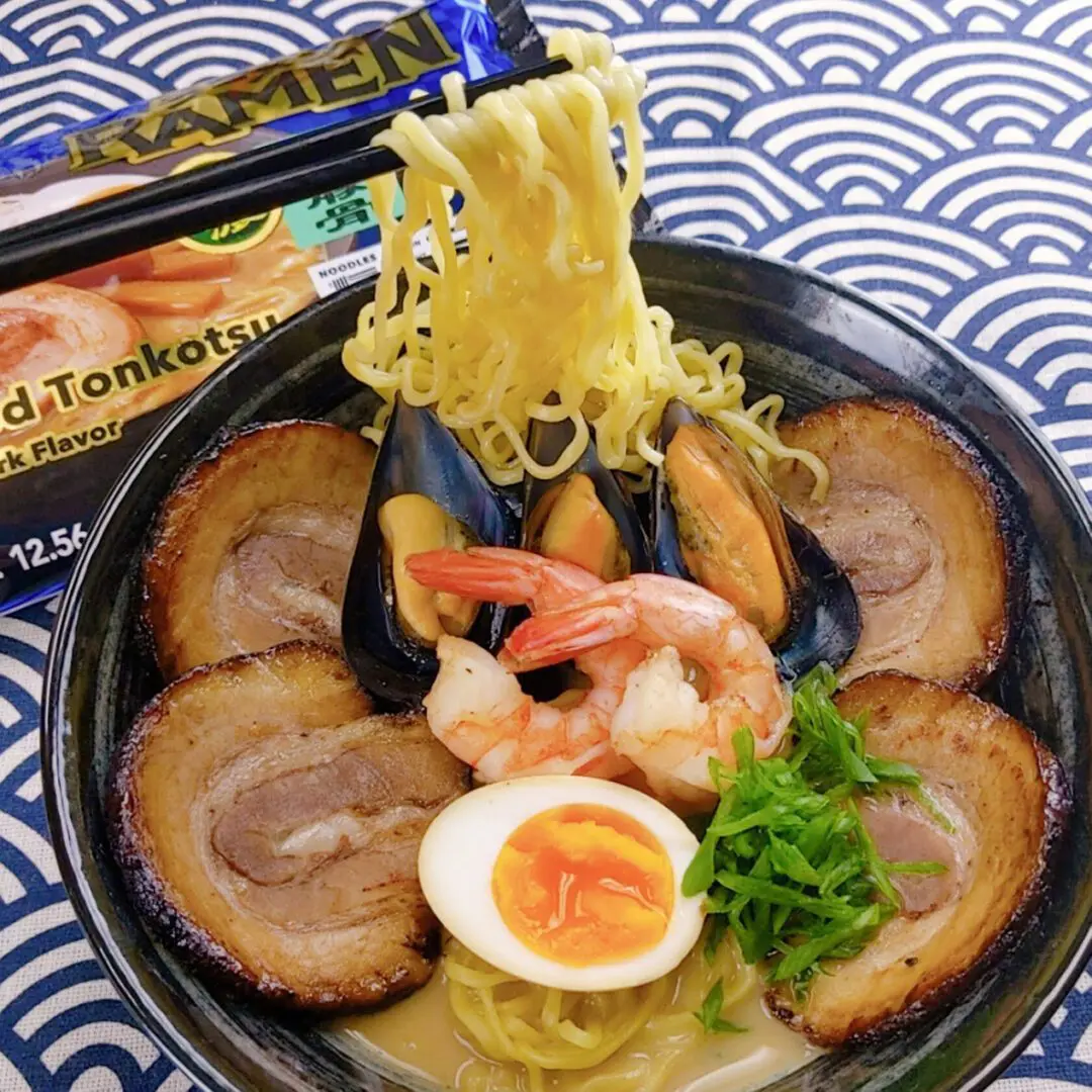 Premium Seafood Tonkotsu Ramen topping with mussels, shrimps, chashu, ajitsuke tamago (marinated egg), and green onion