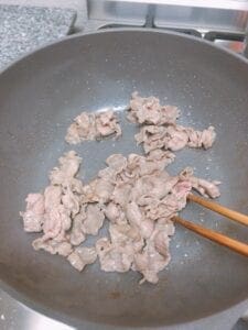 Cook the thinly sliced pork