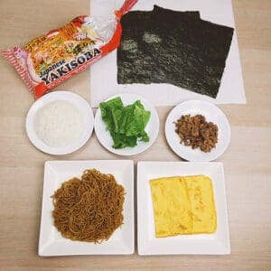 Yakisoba Onigirazu (No Wrap Rice Ball) Step 1 - All ingredients (Myojo Signature Original Yakisoba, Nori Seaweed, rice, leaf lettuce, thinly sliced pork, and egg)