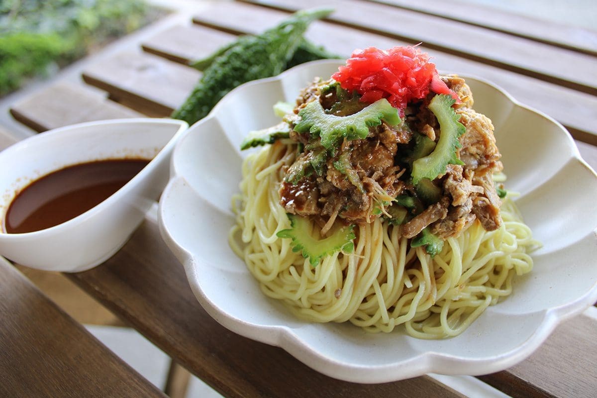 Sesame Hiyashi Chuka with Kalua Pork and Bitter Gourd topped with red ginger