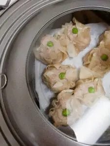 Wonton Shumai - Step 5 - Place parchment paper in a steamer and place the shumai