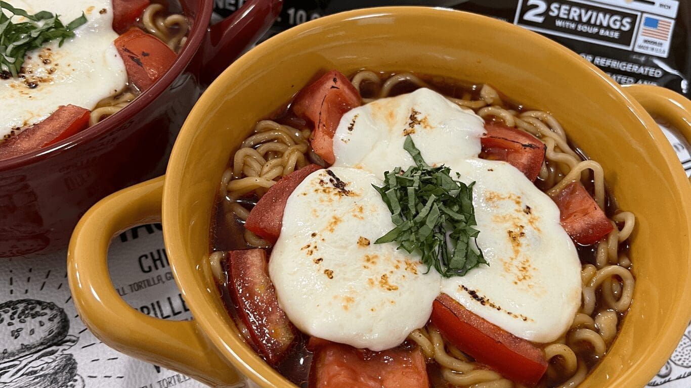 Ramen noodles with mozzarella cheese as topping