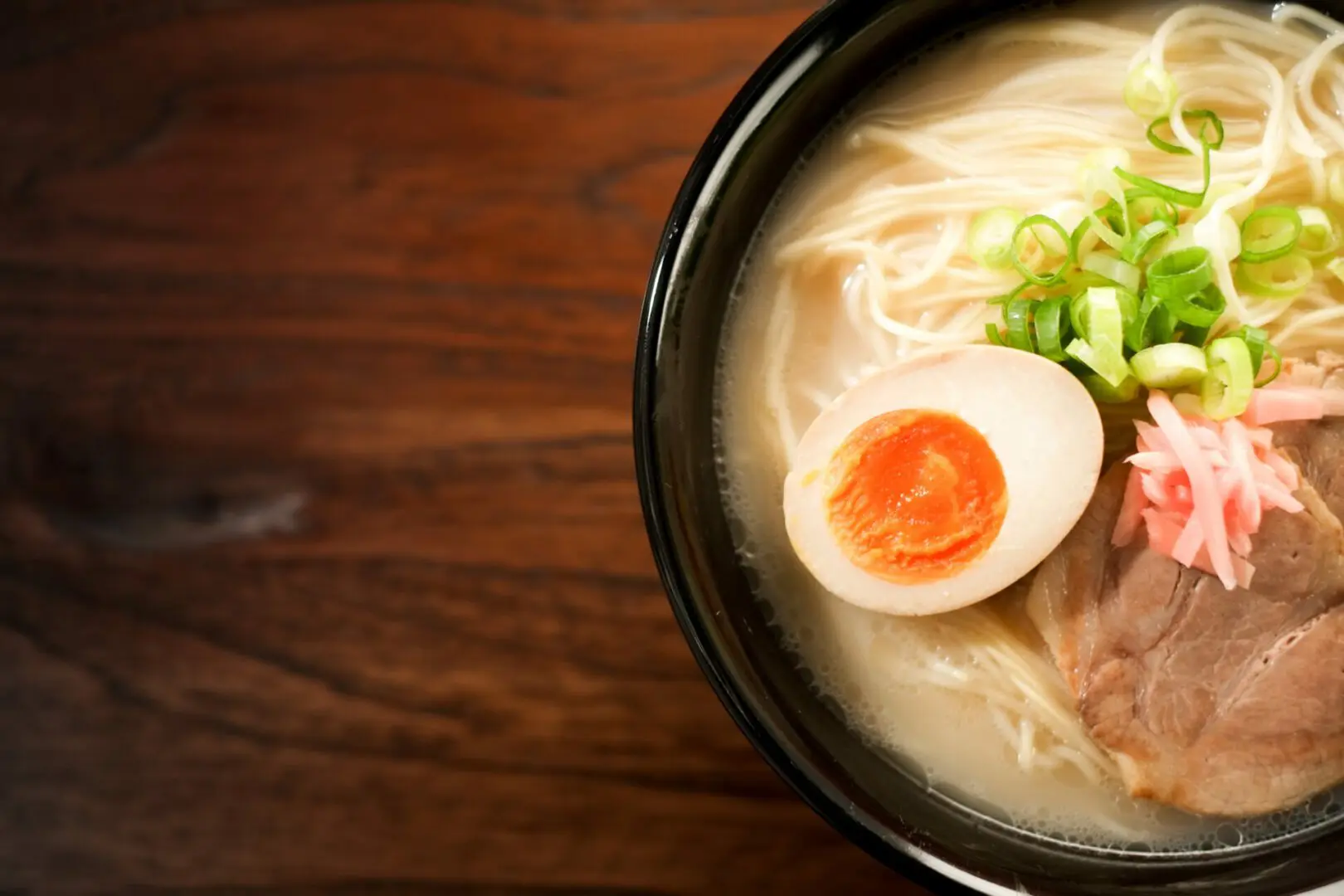 Boiled egg served on top of ramen noodles