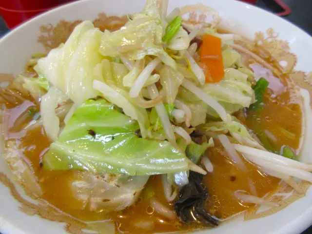 Cabbage served on top of ramen noodles